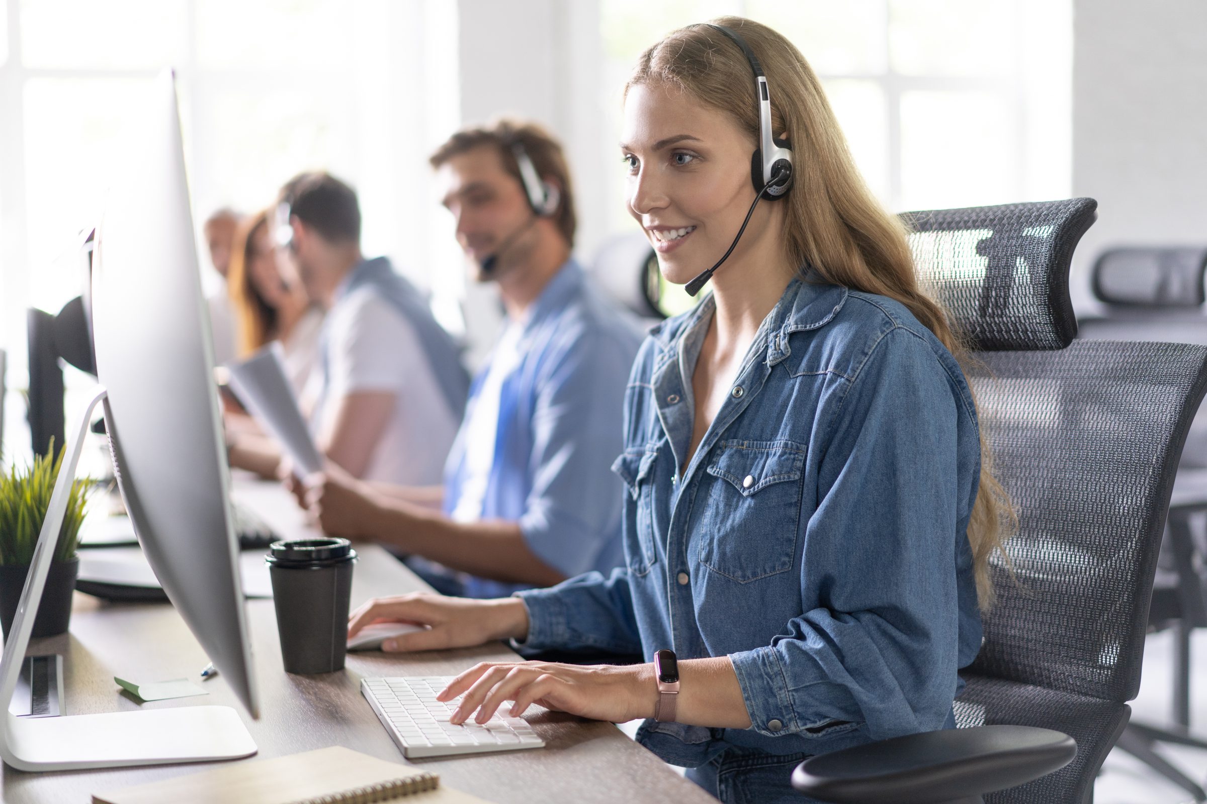 IT help desk technician providing remote support to a business user
